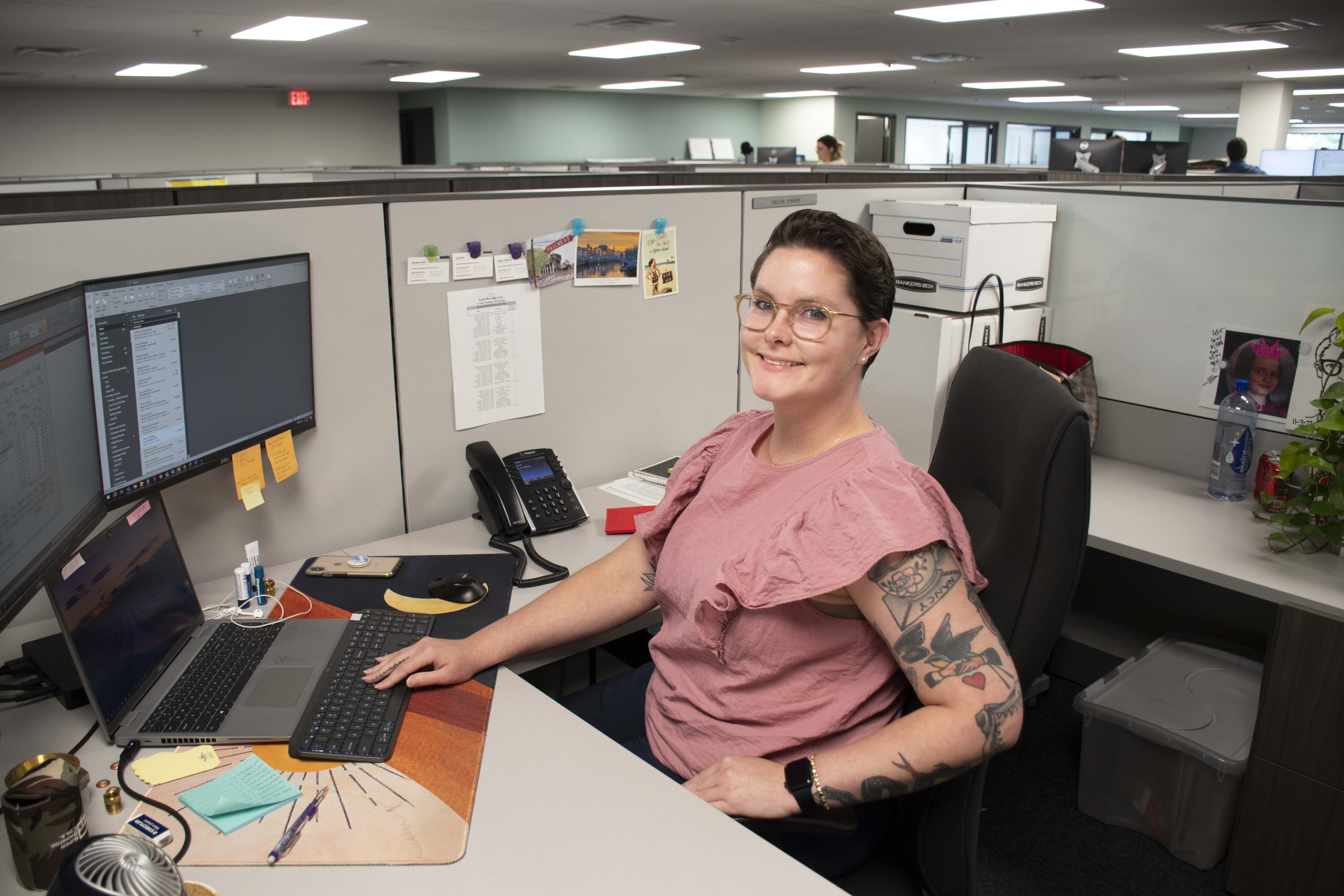 woman sitting at desk with computer