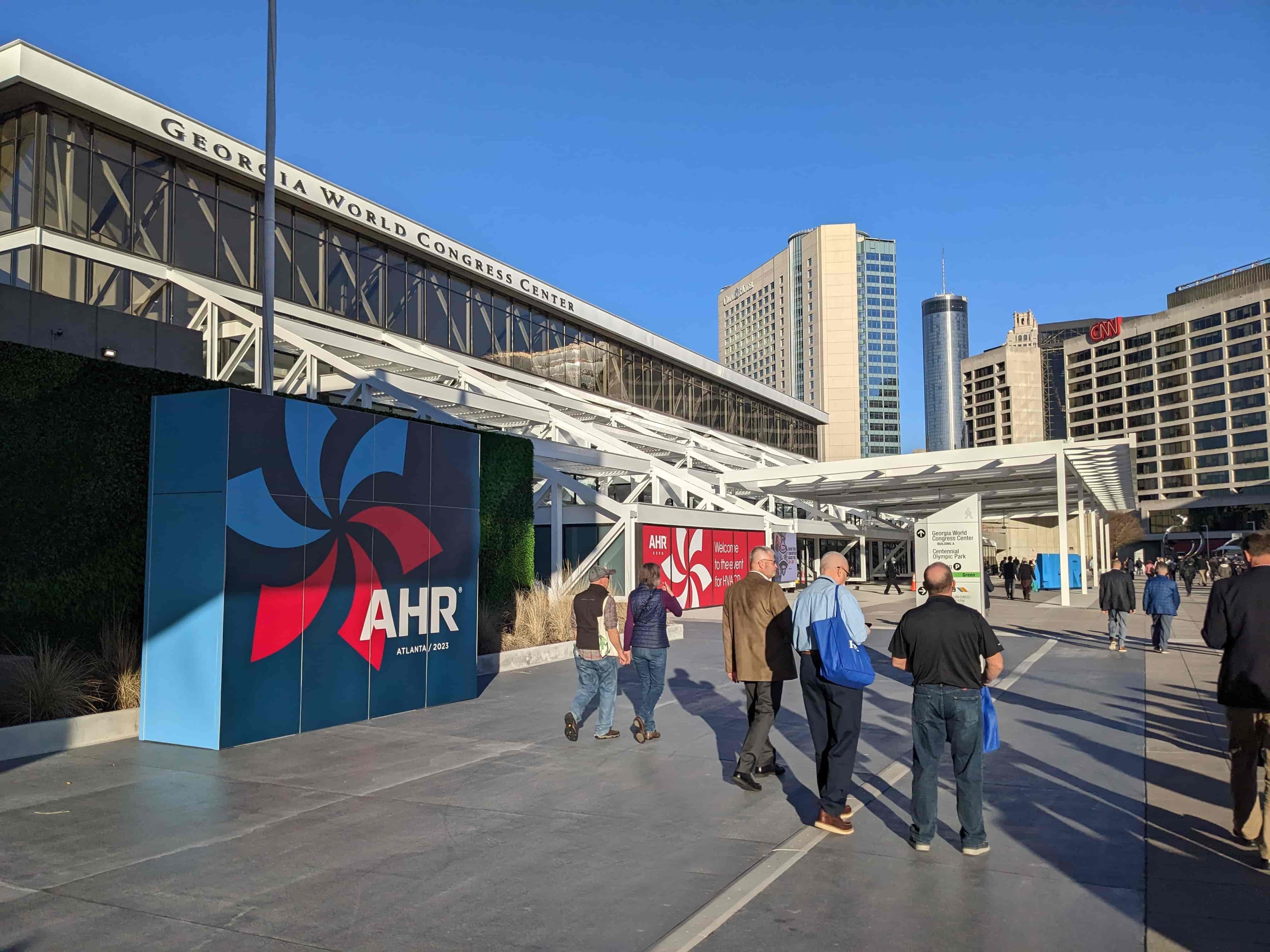 people gathered around tradeshow in downtown urban setting