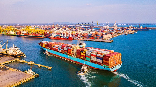 fully loaded container ship entering port