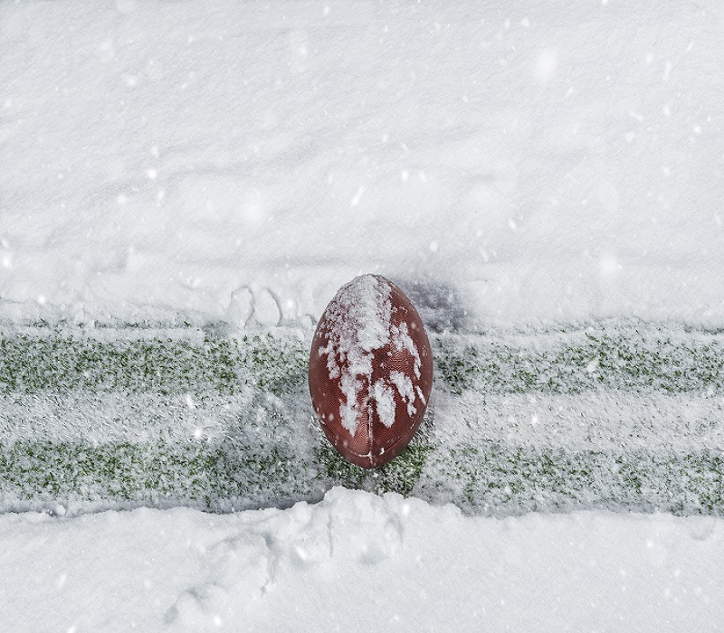 frozen football field with yard line and football