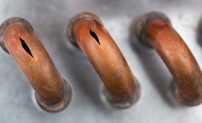 ruptured copper tube at return bend